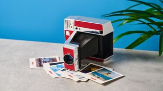 A red and gray Lomography Lomo'Instant Square Glass instant camera