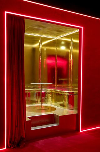 Silencio New York boasts eclectic red and golden interiors drip in neon lights