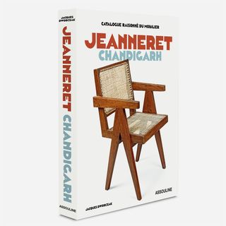 Front cover of Jeanneret Changigarh catalogue with white background and a wooden chair