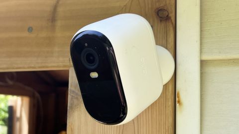 Arlo Essential Outdoor Cam mounted to shed door