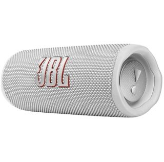 A white JBL Flip 6 speaker on its side against a white background.