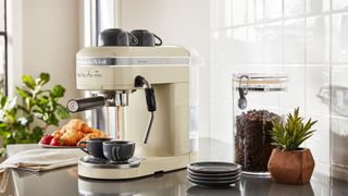 The KitchenAid espresso machine in cream on a kitchen counter