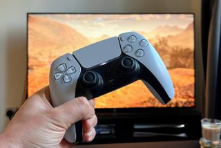 A photo of the PS5 DualSense controller and Horizon Forbidden West