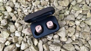 Sennheiser Momentum True Wireless 4 on stones outside