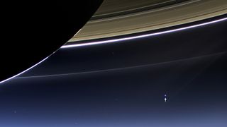 This rare image taken on July 19, 2013, by NASA's Cassini spacecraft has shows Saturn's rings and our planet Earth and its moon in the same frame.