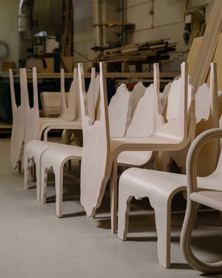 Chairs made of birch plywood stacked at the Made by Choice factory in Finland