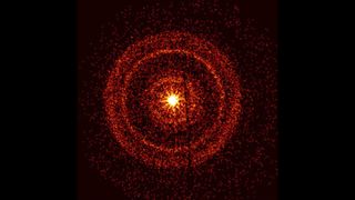 a bright orange center surrounded by grainy red rings.