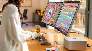 Apple Studio Display and Mac Studio on desk in promo photo