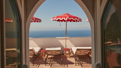 View out to sea from terrace at Il Capri Hotel, one of 10 colourful hotels to discover in 2024