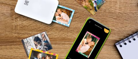 Kodak STEP Slim mobile photo printer next to cell phone