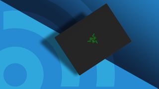 En Razer Blade 14, beste gaming-laptop i 2024, mot en blå Techradar-bakgrunn