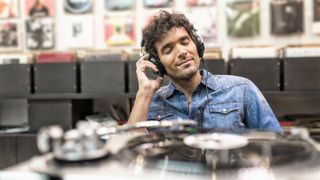 Man listening to music in a record store