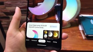 Google Lens shopping feature in the Google Search app on a Pixel 6 phone held in hand