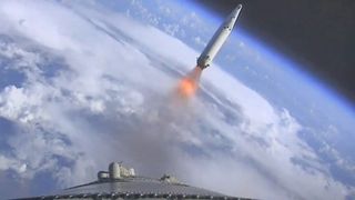 a large white rocket lifts off through a cloudy sky above a massive plume of fire and smoke