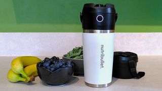 Nutribullet Flip blender on kitchen counter with fruit