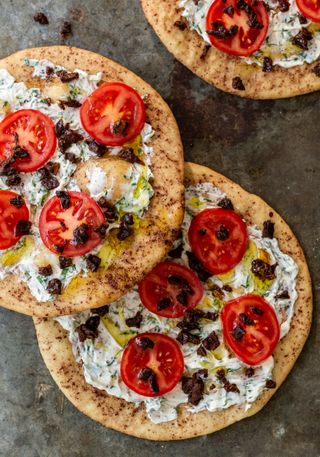 Flatbreads topped with tomatoes from Palestinian recipe book