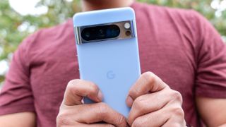 Google Pixel 8 Pro held in hand.