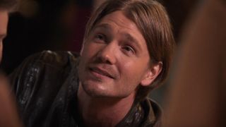 Chad Michael Murray looking up and smiling in One Tree Hill.