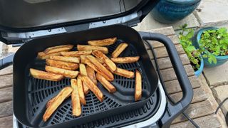 Ninja Woodfire air fryer with fries inside