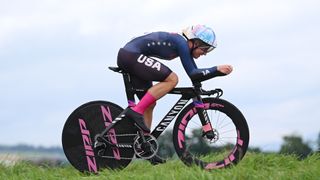 US cyclist Chloe Dygert zooms by on her black and pink bike ahead of the Time Trial event at the 2024 Paris Olympic Games.