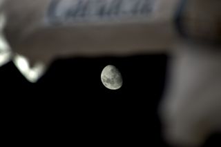 A waxing, gibbous moon peeks out from behind Canadarm2, one of the robotic arms outside the International Space Station, in this photo taken by astronaut Thomas Pesquet. "The moon was playing hide and seek with us today… but I spotted it!" Pesquet tweeted when he shared the photo.