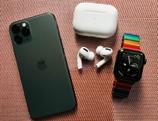 Midnight Green iPhone 11 Pro, AirPods Pro, and Apple Watch Series 5 Edition Space Black Titanium with JUUK Rainbow Ligero Band