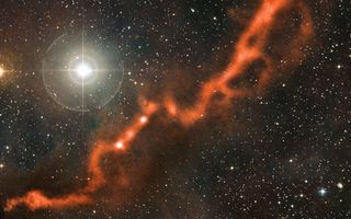 This image from the APEX telescope, of part of the Taurus Molecular Cloud, shows a sinuous filament of cosmic dust more than 10 light-years long. 