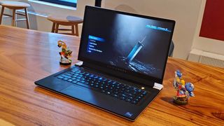 An Alienware x15 R2 gaming laptop on a wooden table