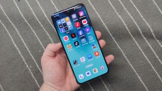 The Oppo Reno 12 Pro on a gray and white background.