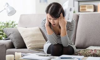 Woman reacting to high electricity bills