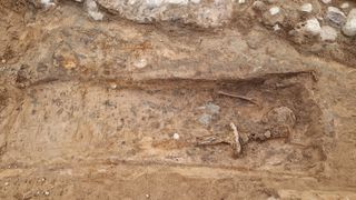 A sword in an excavated grave in Sweden.