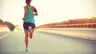 A photo of a female running in the best women&#039;s running shoes 