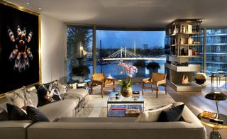 Living room with large windows overlooking a bridge