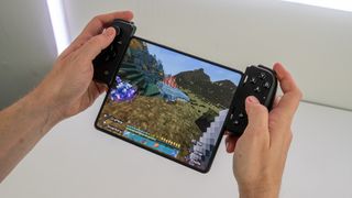 A Samsung Galaxy Z Fold 3 mounted in a Razer Kishi V2 controller