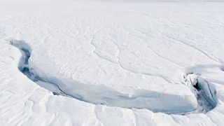 A crack in an ice sheet an Antarctica ice sheet caused by climate change