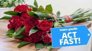 A bouquet or red roses lying on a table