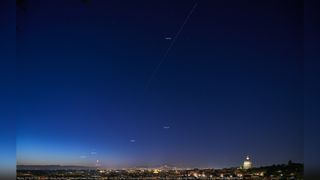 Planets Jupiter, Venus, Mars, Saturn and the Moon shine above Rome at dawn, while the Tianhe Chinese space station crosses the sky on April 27, 2022.