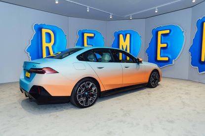 BMW Alex Israel Art Basel Miami Beach 2023: BMW car amid head-shaped screens with letters on