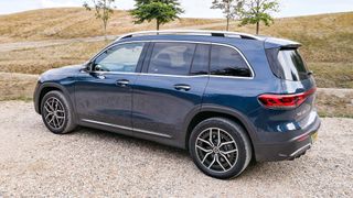 Mercedes-Benz EQB parked outside on gravel driveway