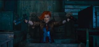 a wild woman with red hair brandishing a pair of sci-fi pistols