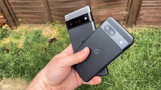 Google Pixel 8a and Google Pixel 6 Pro held together in back garden