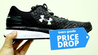 Under Armour running shoe against green background with deals badge 