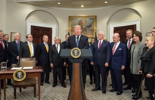 President Donald Trump speaks before signing the Presidential Space Directive - 1, directing NASA to return to the moon, in the Roosevelt room of the White House on Dec. 11, 2017.