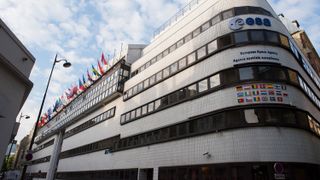 A buidling with flags that show the intergovernmental organizations such as the European Space Agency are not bound by national law of its member states.