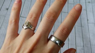 Woman's hand wearing Oura smart ring