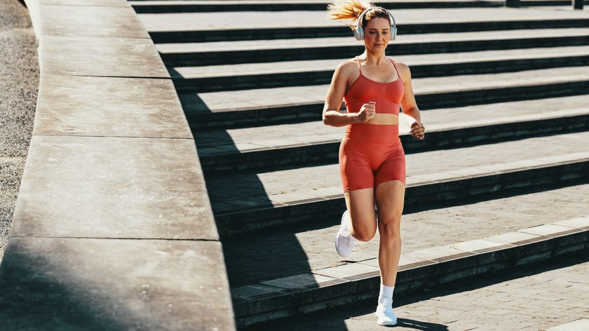 a photo of a woman running down a set of steps