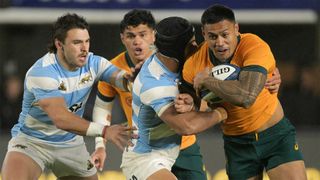 Australia centre Len Ikitau evades a tackle from Argentina's Santiago Chocobares during the sides' August 2024 Rugby Championship match.