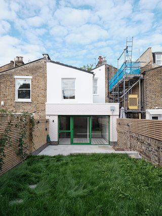 rear view of white terrace house extension