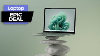 Surface Laptop 5 balancing on a tier of rocks