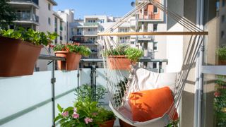 White hammock chair on balcony